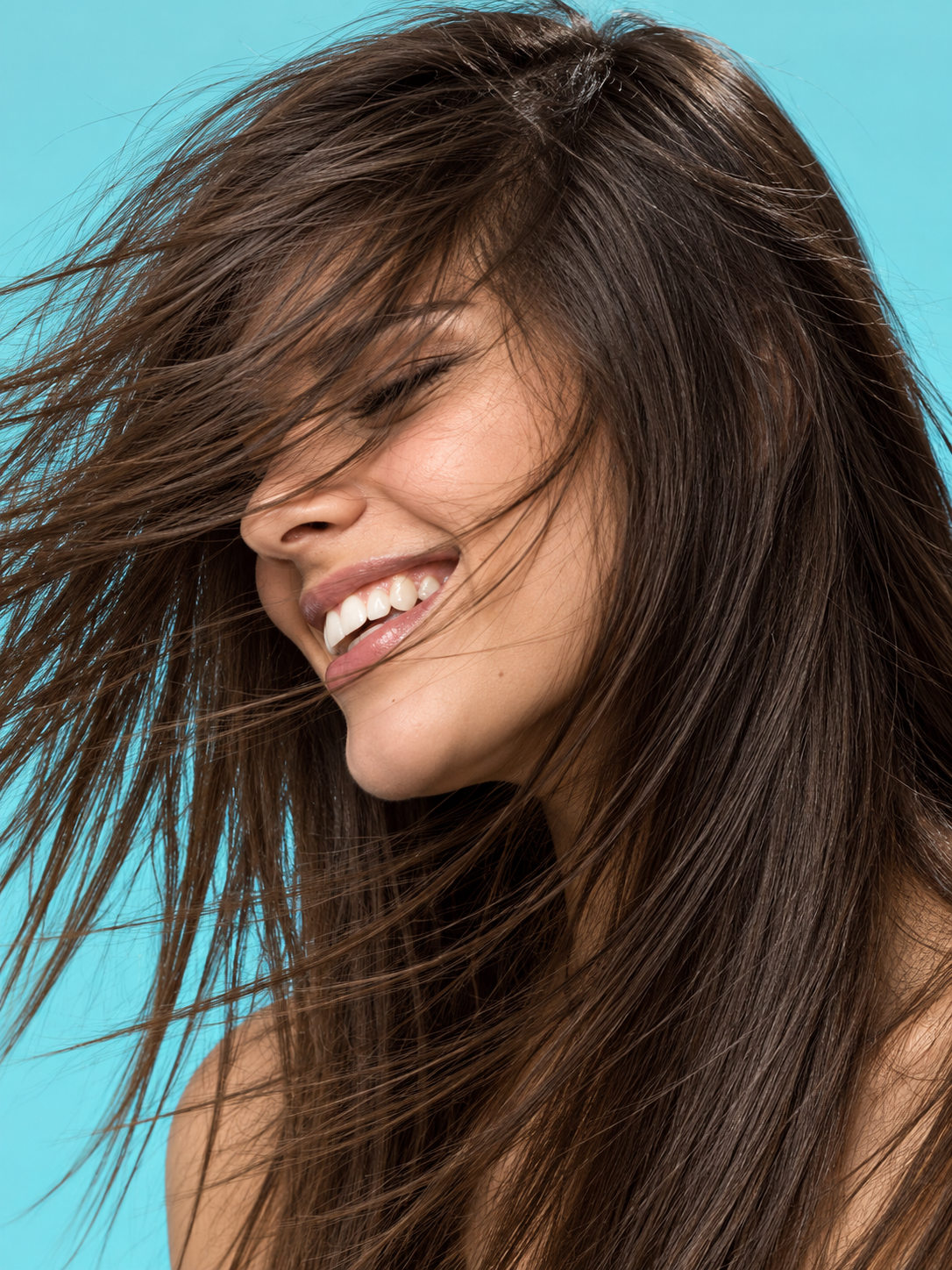 Windblown Smile Against Aqua.png