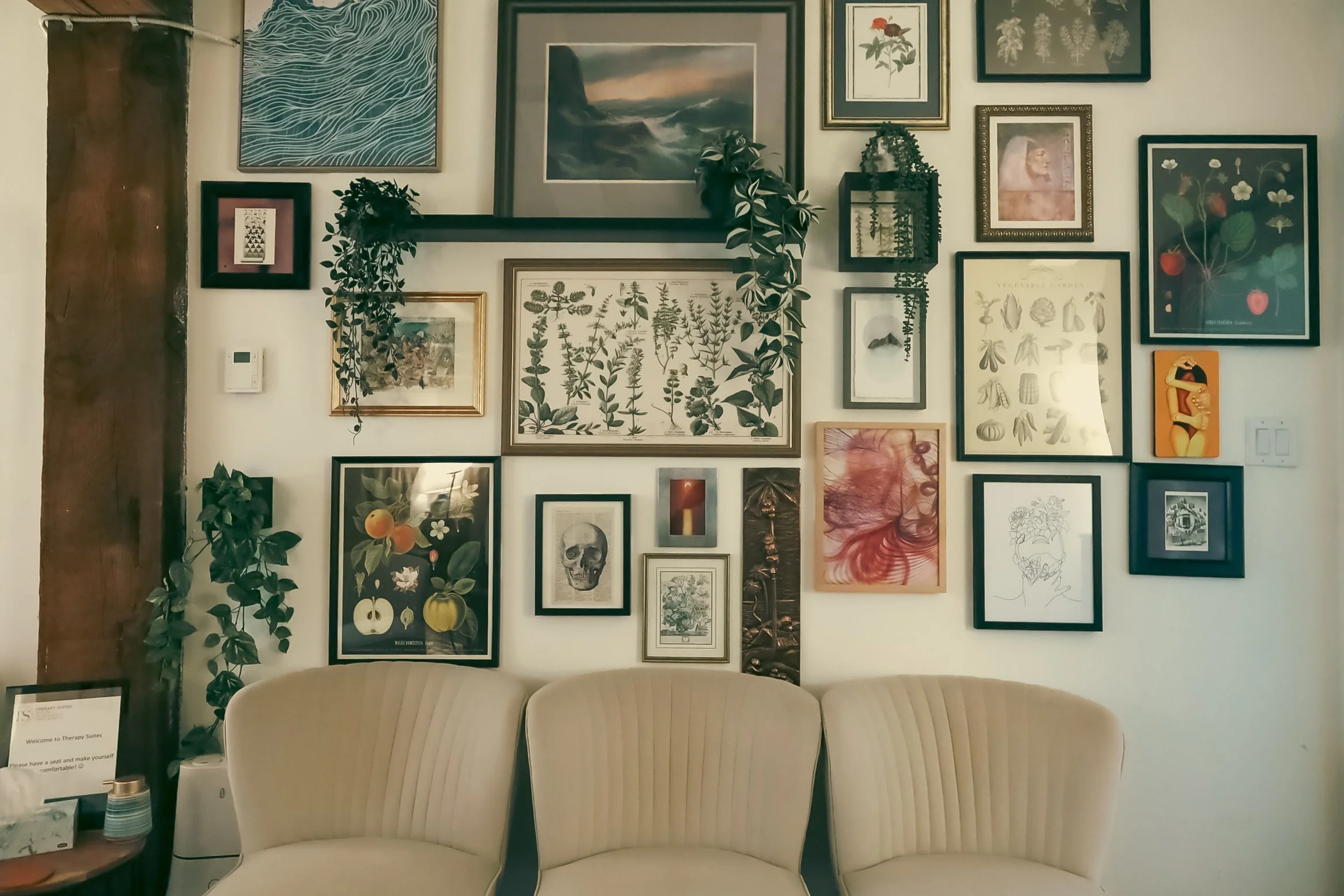 Therapy Suites waiting area with framed artwork and seating