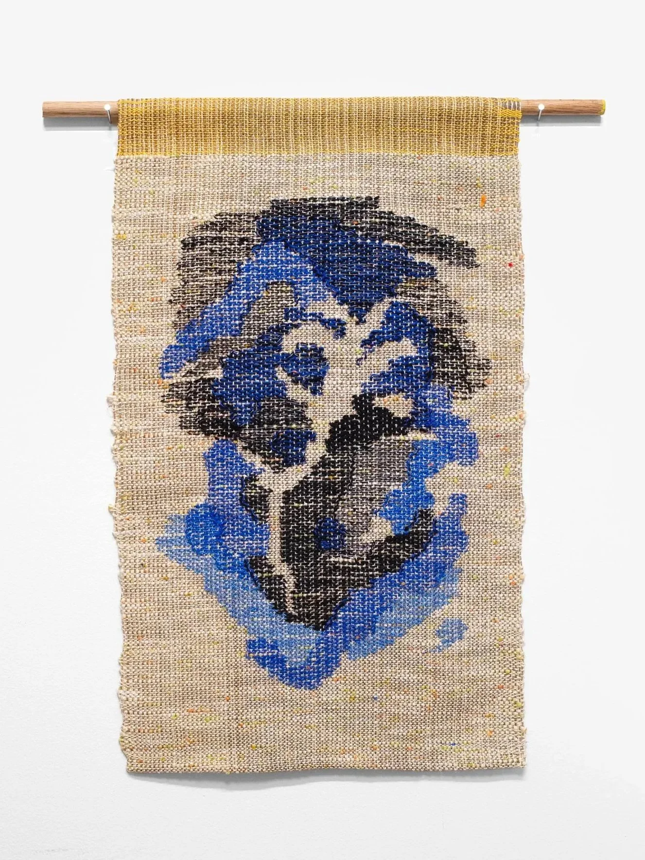small tapestry with black and blue