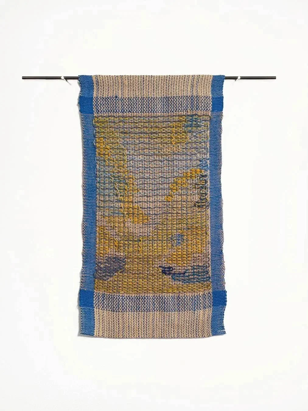 small tapestry in blue and gold