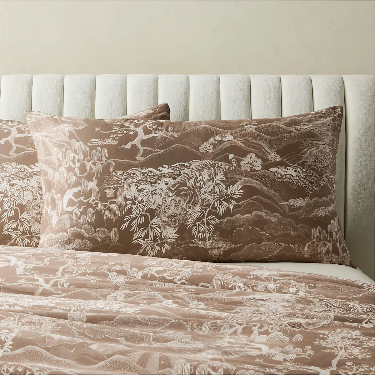 Sloane Organic Cotton Sateen Pillow Shams by CB2. A scenic motif in warm brown and ivory brings intricate pattern, gentle sheen, and quiet richness to layered bedding.