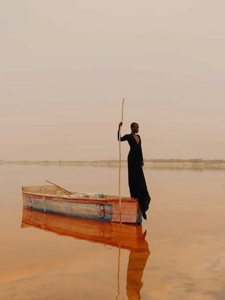 Medusa by Charlotte Lapalus, through Antipode Gallery. Photographed at Senegal’s Lake Retba, a solitary figure and mirrored boat create a quietly powerful composition in warm tones.