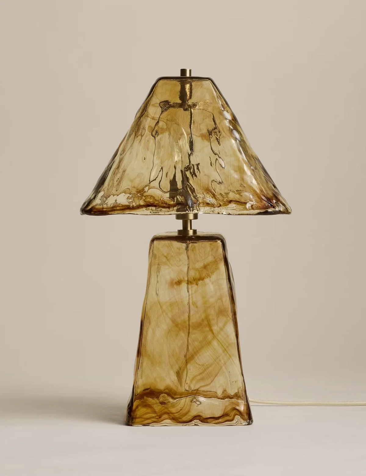 All Over Glass Table Lamp by Marks & Spencer, featuring hand-blown amber glass with an irregular sculptural shade and coordinating textured glass base.