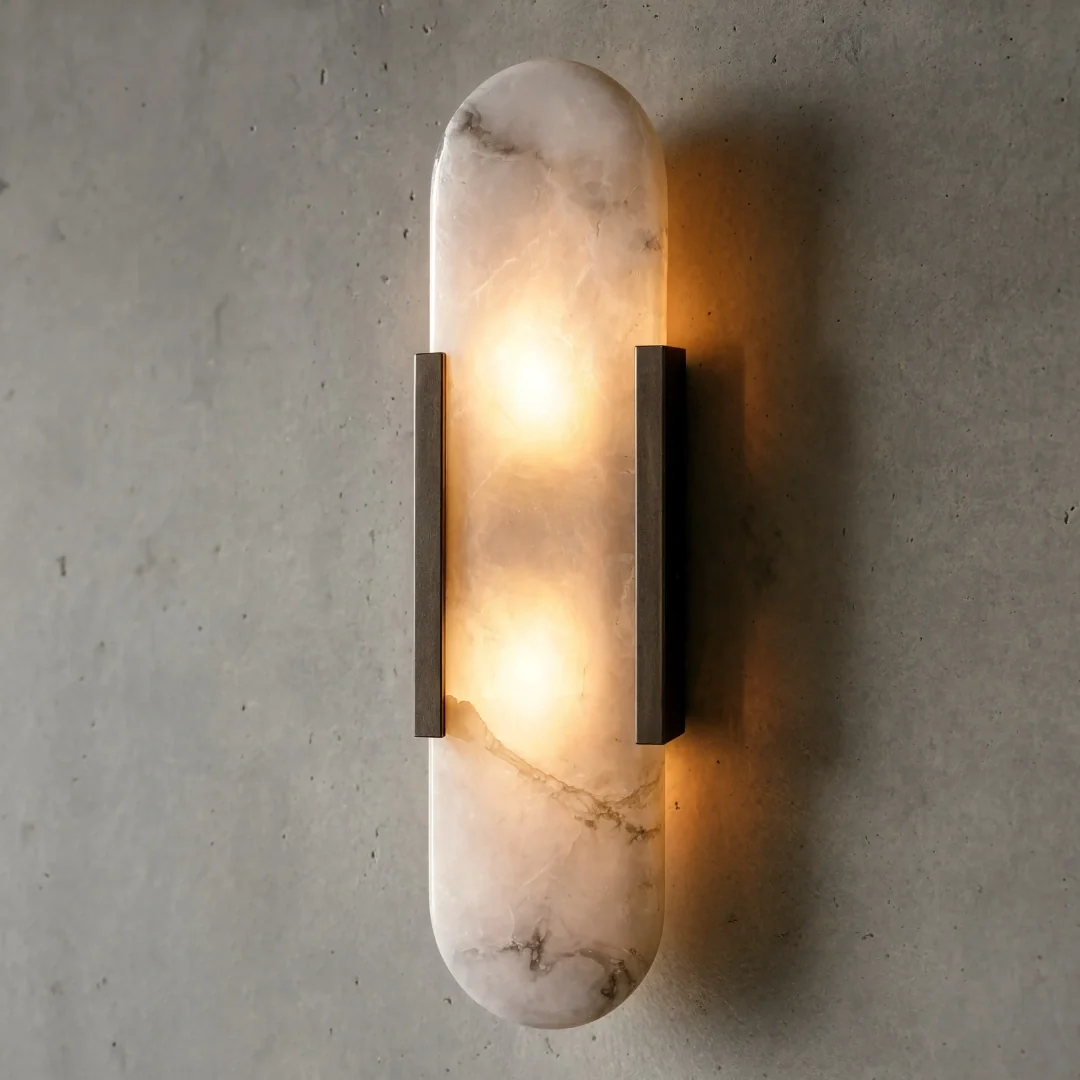 Melange 20" Elongated Sconce by Kelly Wearstler, pairing luminous natural alabaster with contrasting metal details in a clean, sculptural form.