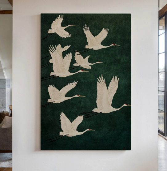 Elegant Cranes in Flight through Kool Design. Ivory cranes sweep across a deep green background, bringing graceful movement and Japanese-inspired elegance to a room.
