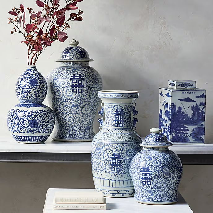 Blue Ming Ceramic Collection, through Frontgate. Traditional blue-and-white motifs and varied silhouettes bring timeless pattern, chinoiserie charm, and antique-inspired elegance to a collected interior.