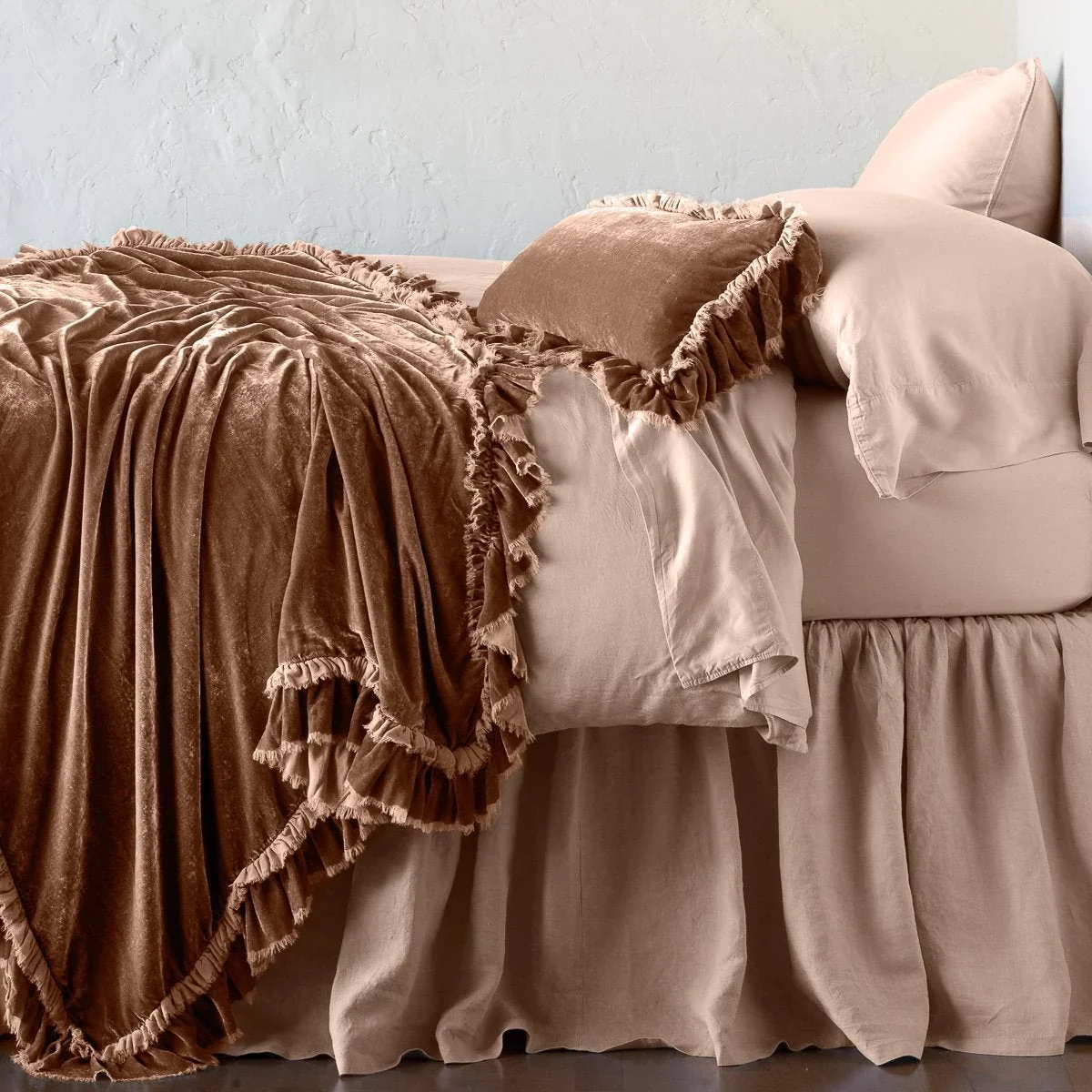 Loulah Silk Velvet Throw by Bella Notte, through FOR Living. Lustrous velvet, flowing folds, and delicate ruffled edges bring romantic softness and inviting warmth to layered bedding.