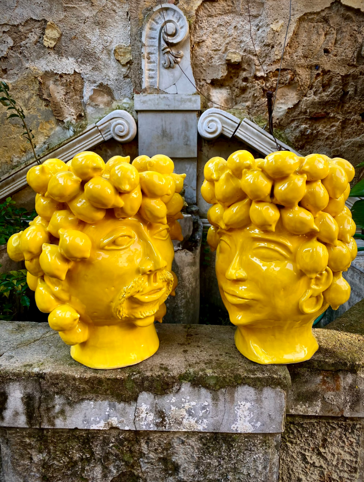 Queen and King Piana of Lemon by Patrizia Italiano, through Wescover. Sculptural faces and glossy yellow lemons bring playful Mediterranean character.