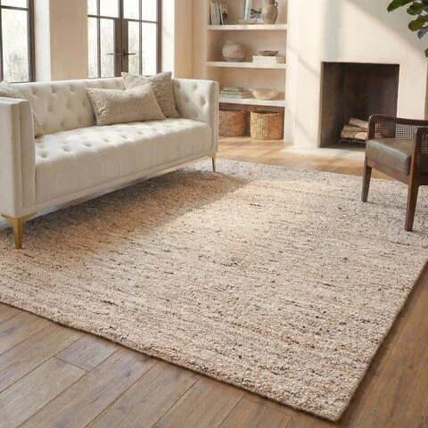 Natura Handmade Wool Area Rug by SAFAVIEH, featuring a softly textured natural weave in warm beige—a quiet, versatile foundation that brings warmth and organic texture to a room.