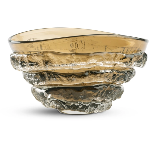 Modena Bowl by FlowDecor, through Lighting New York. Warm amber glass and rippled contours catch the light with sculptural elegance.