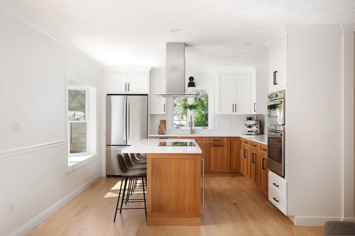 The lighting in this kitchen was *chef's kiss* 🤩 It was such a fun project fun to shoot. The natural wood and bright white combo makes for such an inviting, warm space. 

Cabinets: @russoskitchens 
Counters: @ecmarblegranite 
Backsplash: @nationalti