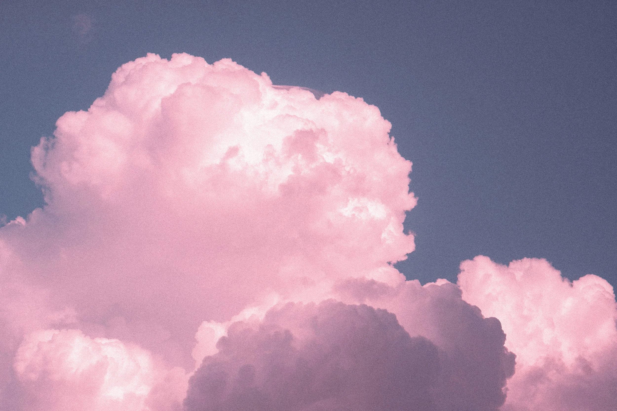 Pink and gray clouds in the sky