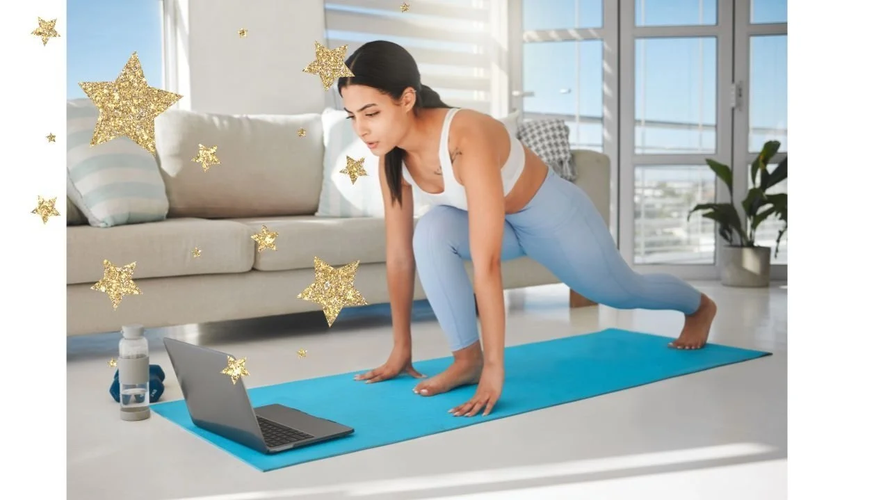 A woman practicing yoga on a blue mat indoors with a laptop, water bottle, and decorative gold stars around her.