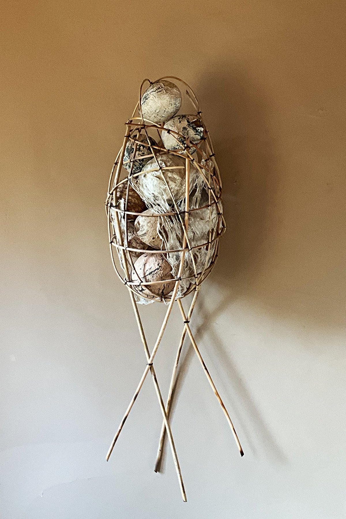 Guest Artist. "Memories". rattan, cast fiber paper, ink, encaustic, indigo. 
37 x 12 x 11 inches