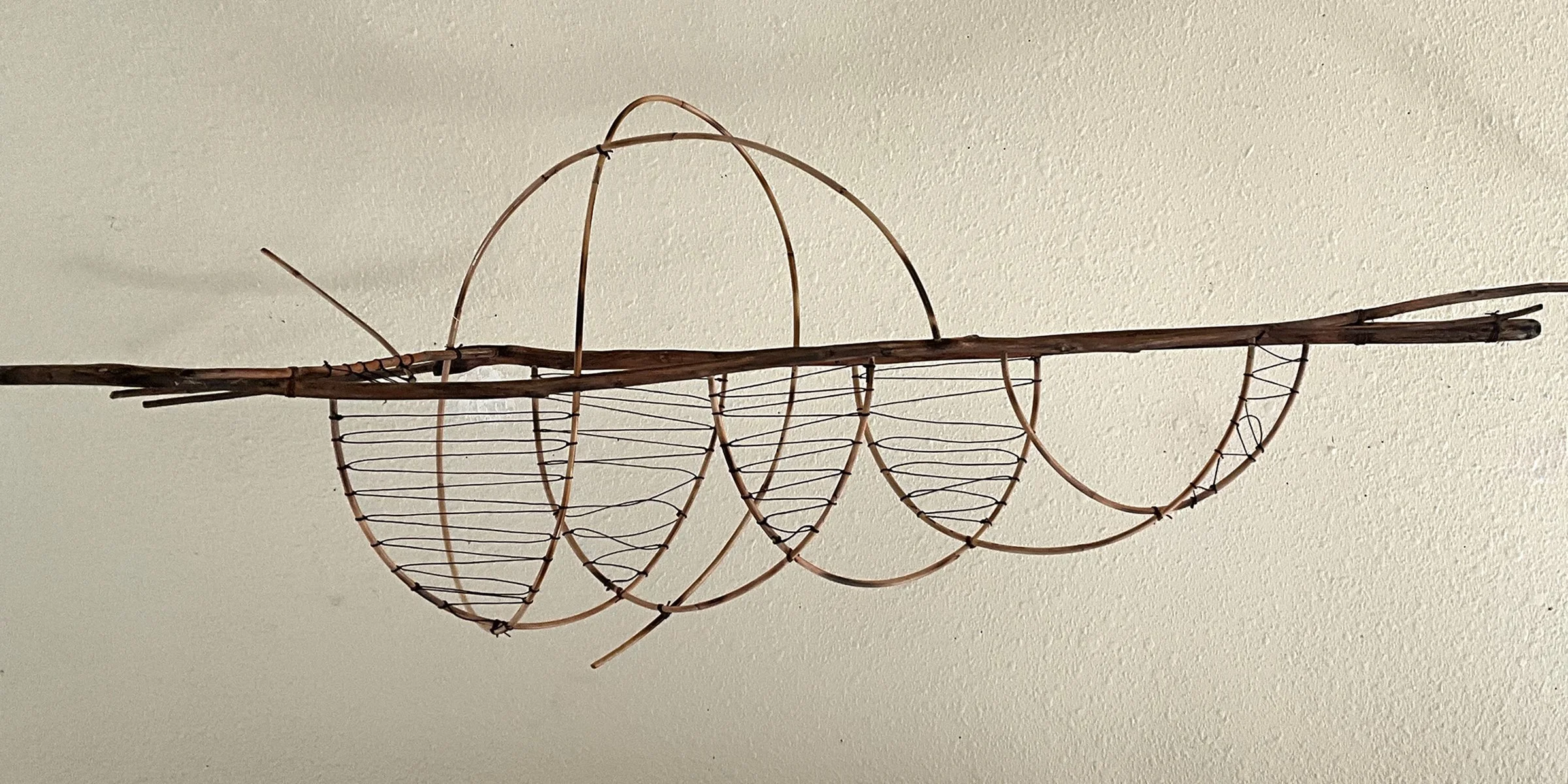 Blackbird, willow, rattan, linen thread. 38 x 9 x 12 inches