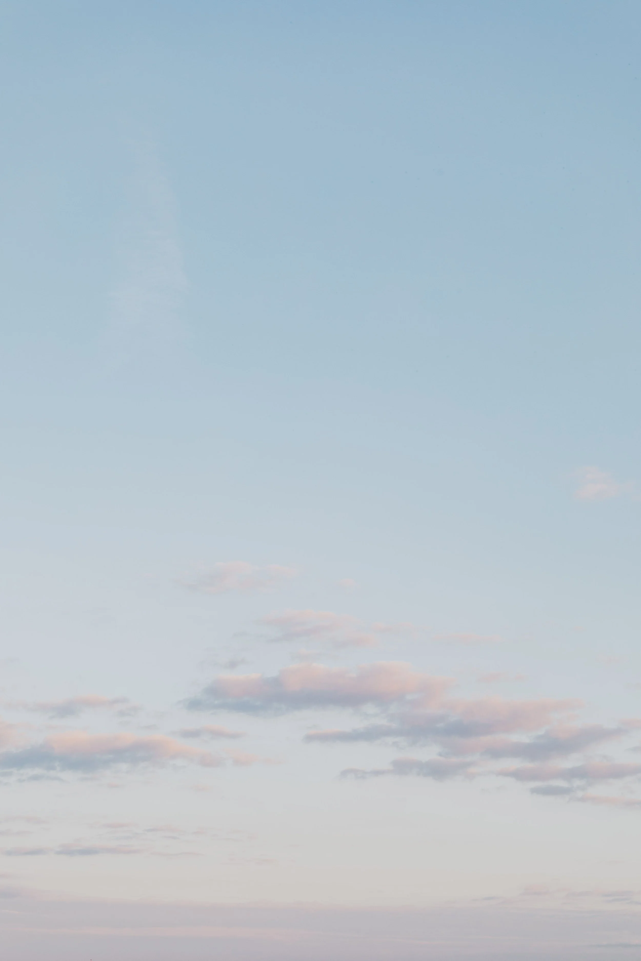 an Image of the Sky with Sparse Clouds