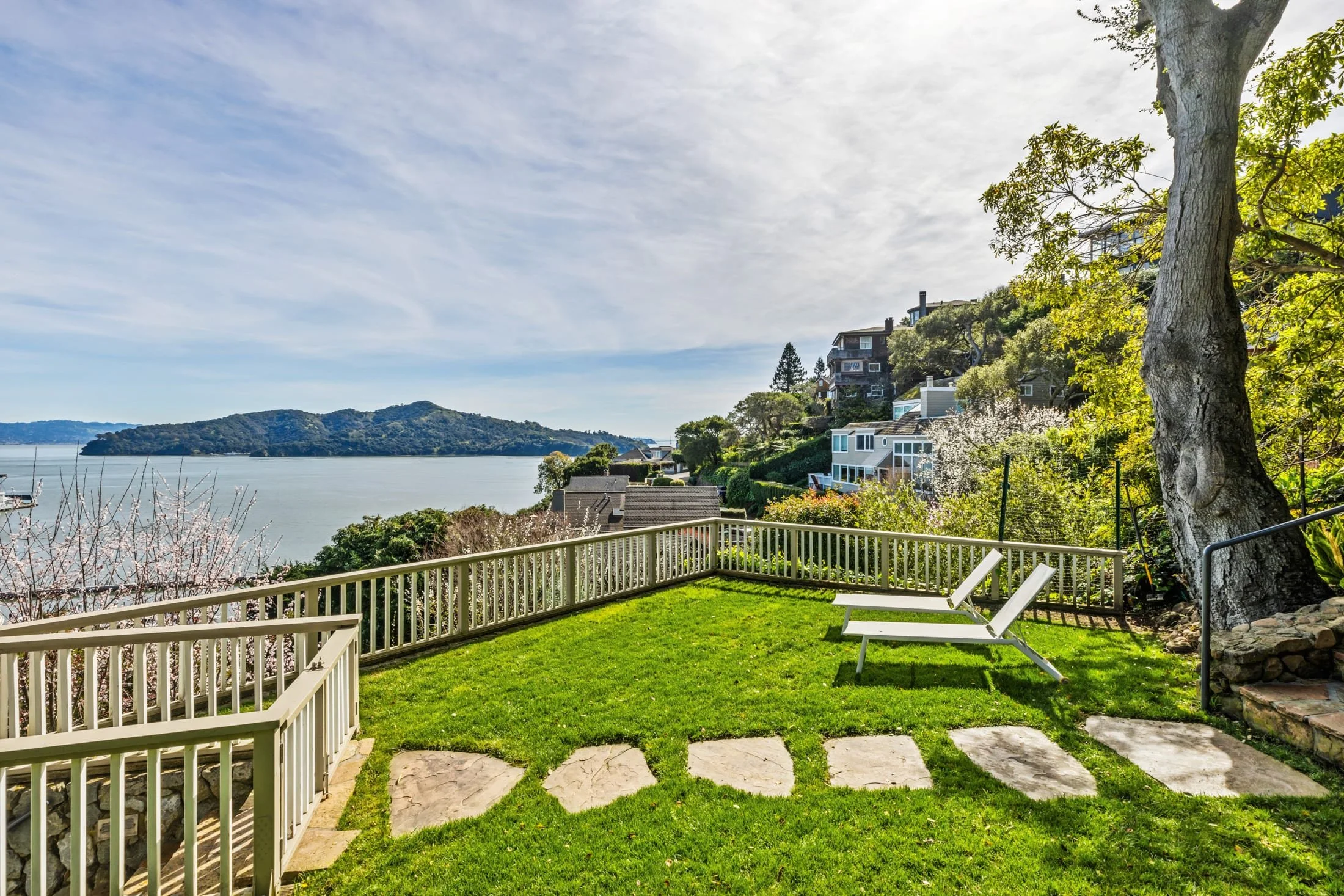 Landscaped backyard of a Marin County home overlooking the water, professionally maintained for comfort and long-term care.