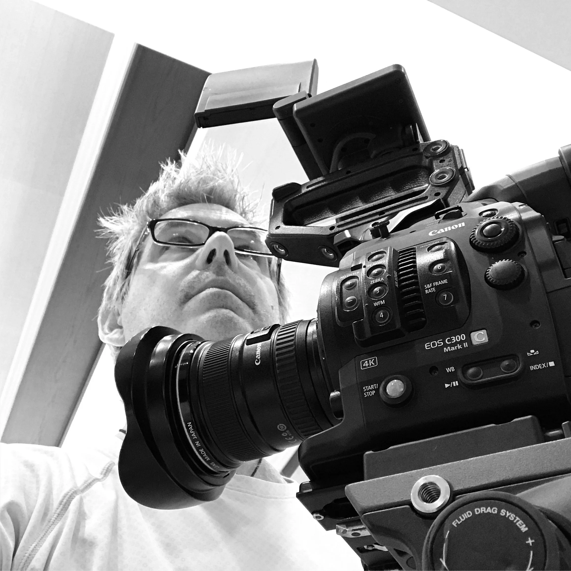 Director John Scoular  operating a professional Canon EOS C300 Mark iii camera.