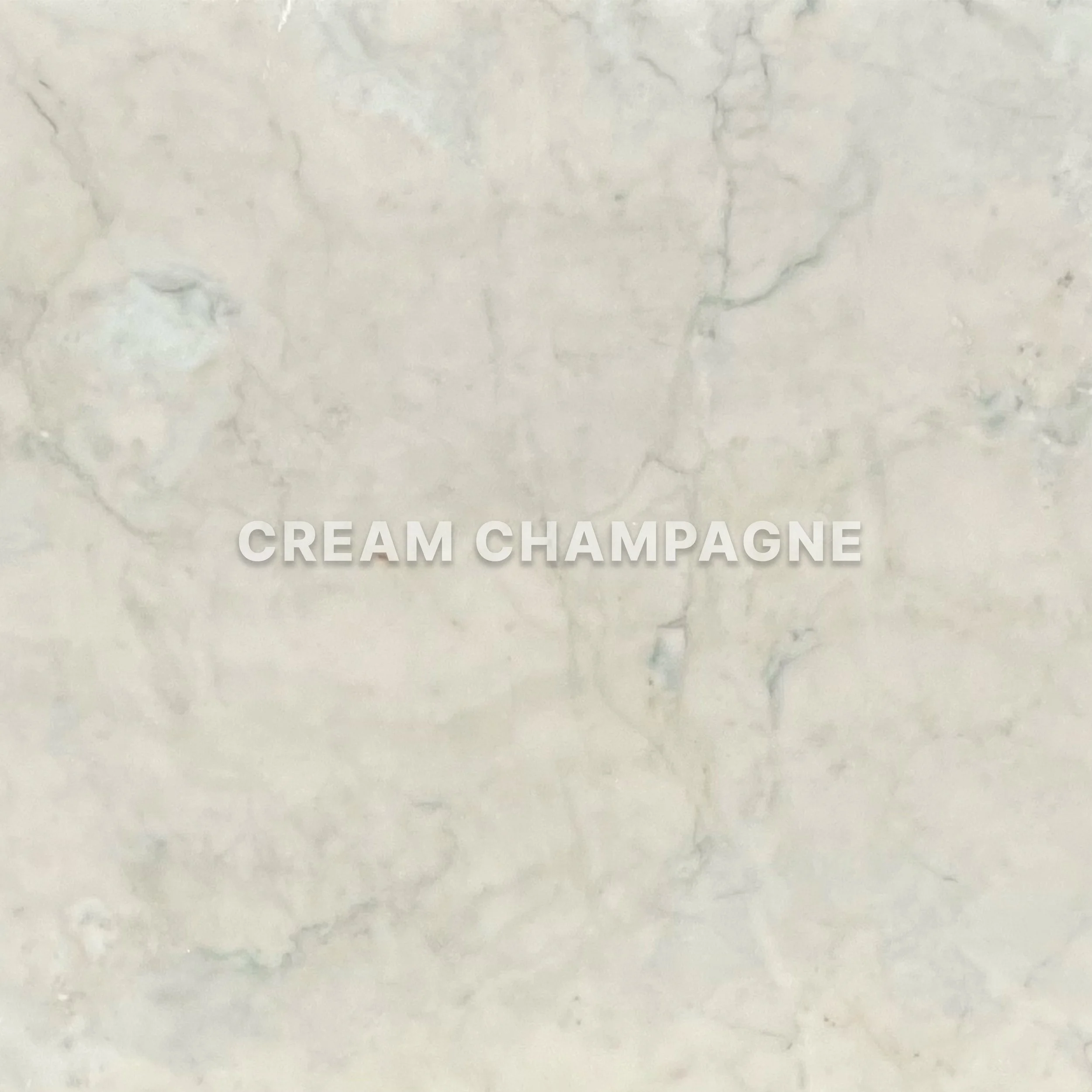 A marble surface with the words "CREAM CHAMPAGNE" written in gray centered text.