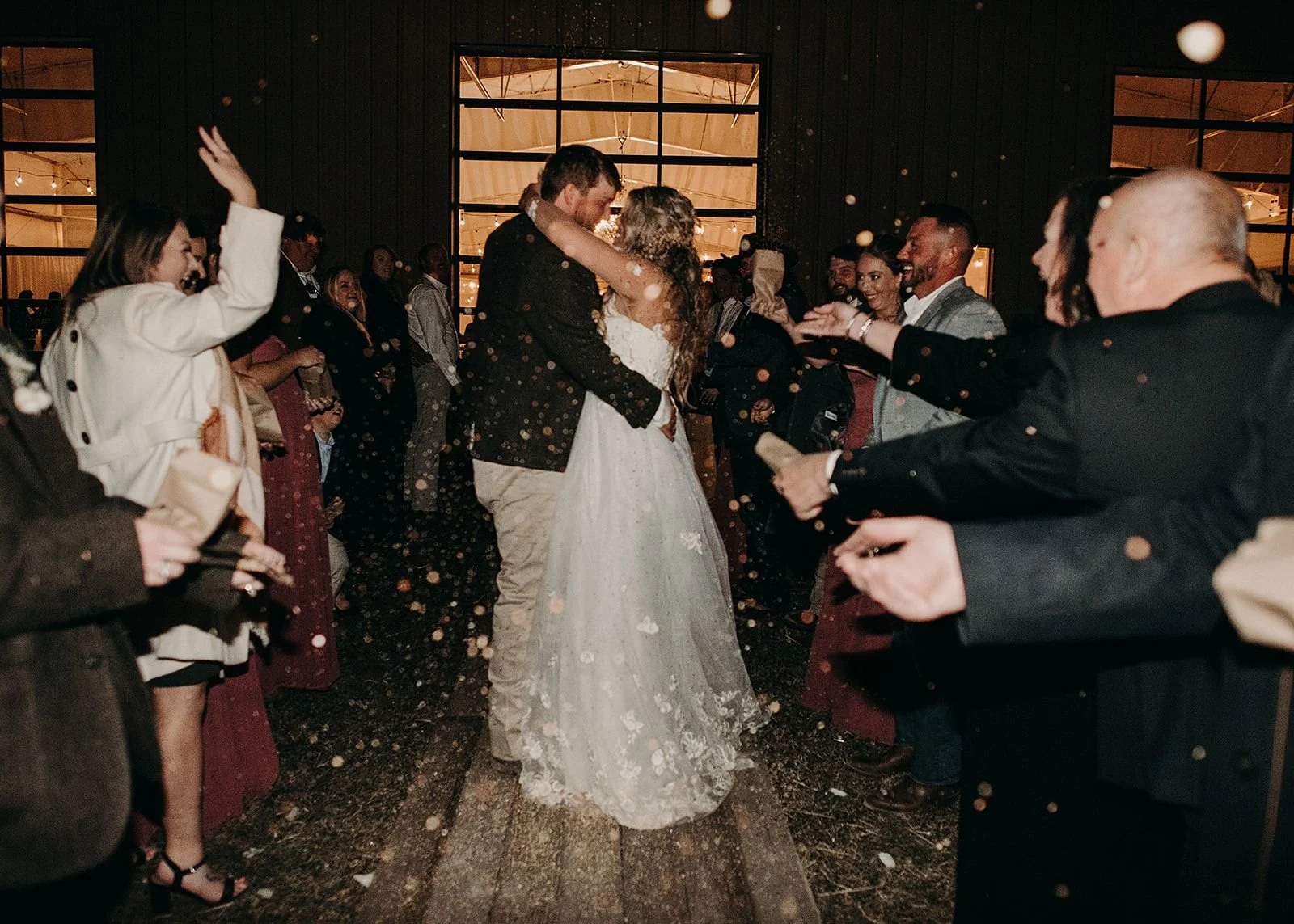 Bride and groom sharing a confetti grand exit at their Colorado destination wedding