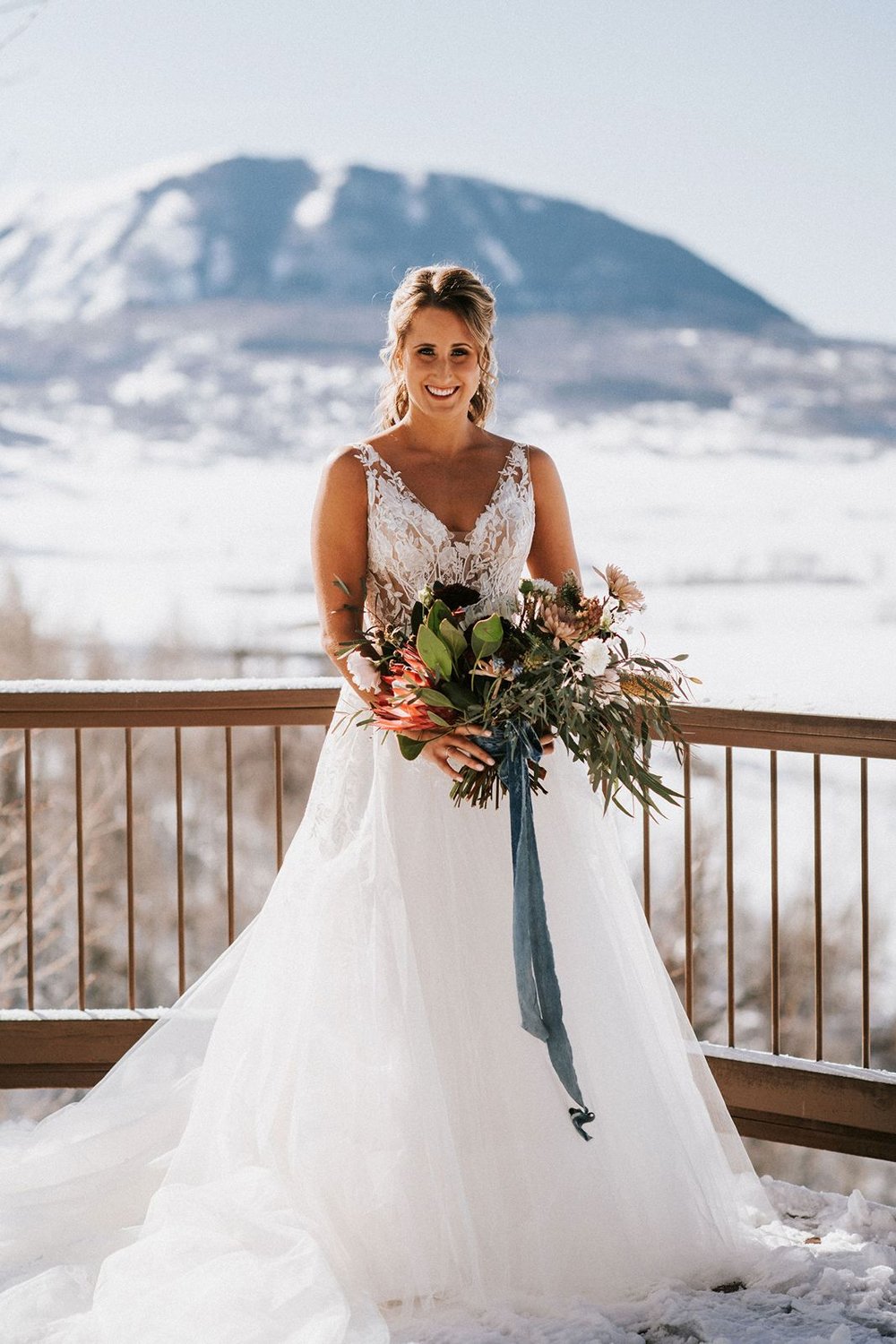 bride-with-bouquet-and-mountains.jpg