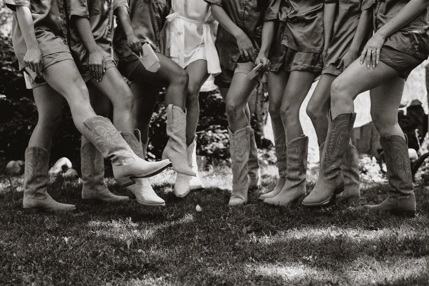 Bridesmaids and bride with Western boots at luxury ranch wedding in Steamboat Springs