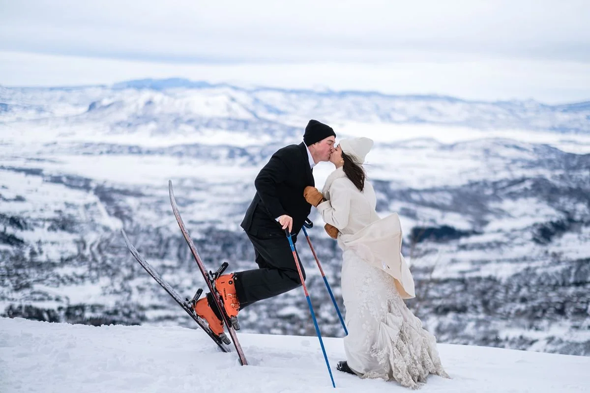 Couple kissing on skis at Steamboat Springs