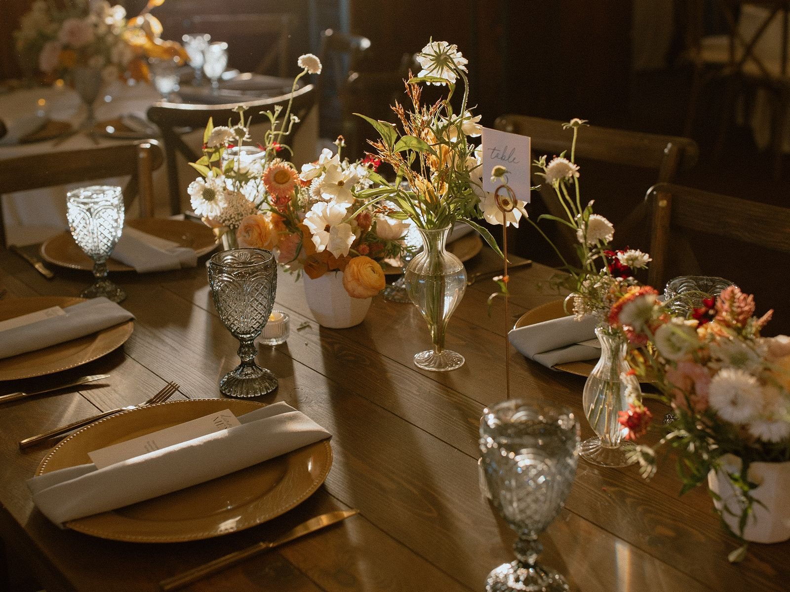 Fall tablescape on farmhouse table at luxury ranch wedding venue in Steamboat Springs