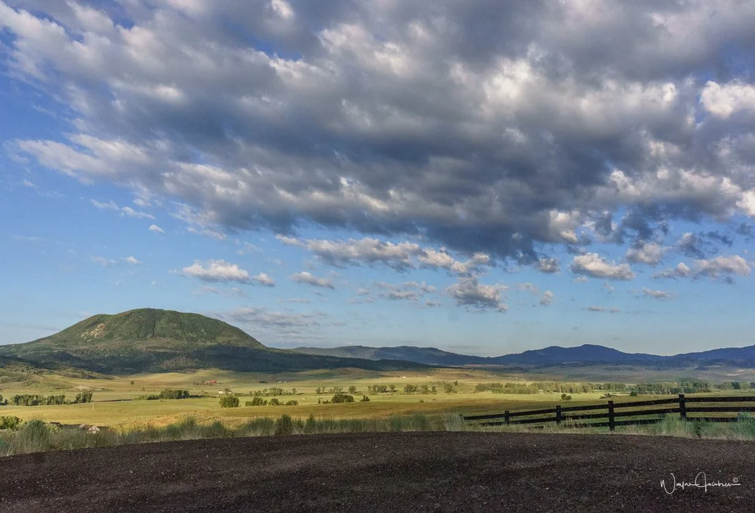 Mountain views at sunset from luxury ranch wedding venue in Colorado. Near Houston.