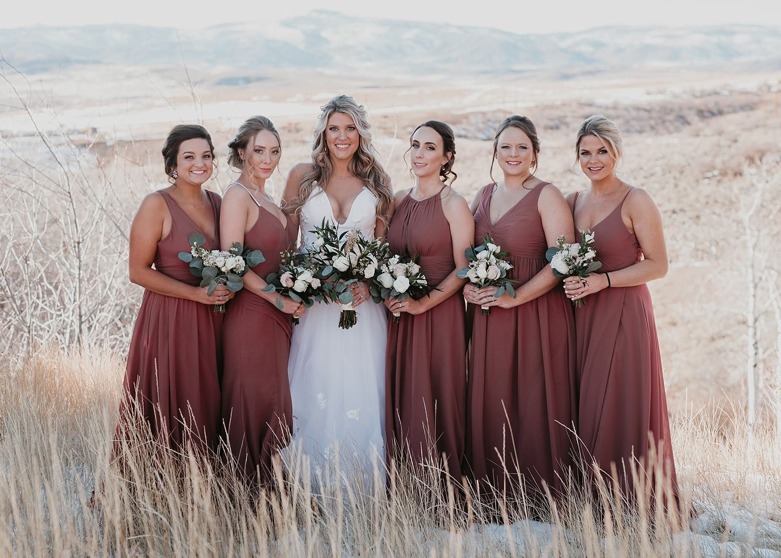 Emotional first look between the bride and her bridesmaids at a luxury winter wedding in Colorado