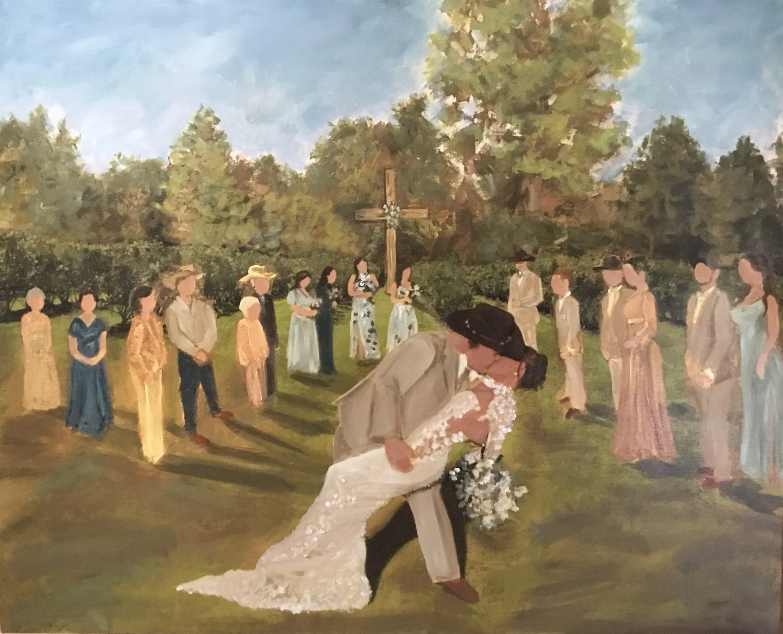 A group of people standing outdoors in front of a cross, likely participating in a religious ceremony or procession, with trees and a cloudy sky in the background. In the foreground, a person with dark, curly hair is holding a pillow, possibly for a wedding or similar event.