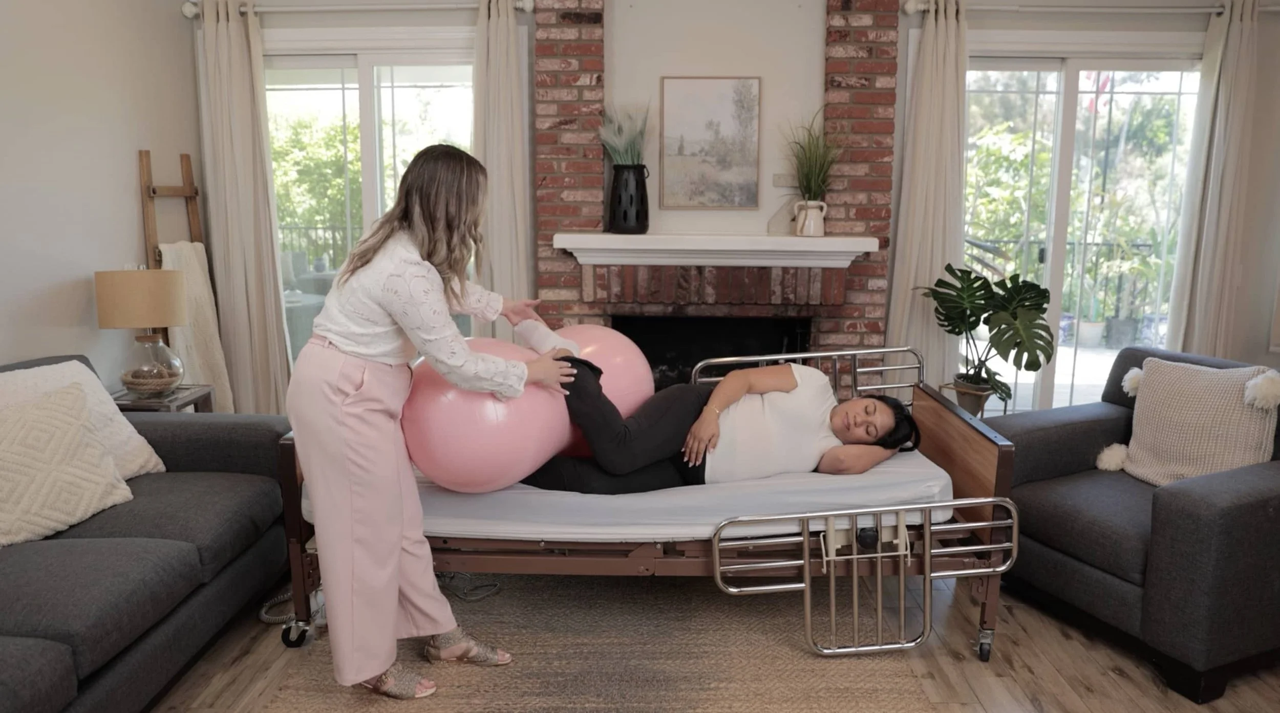 Bree Zaccaro, a certified childbirth educator in Orange County, helps prep a mother for birth.