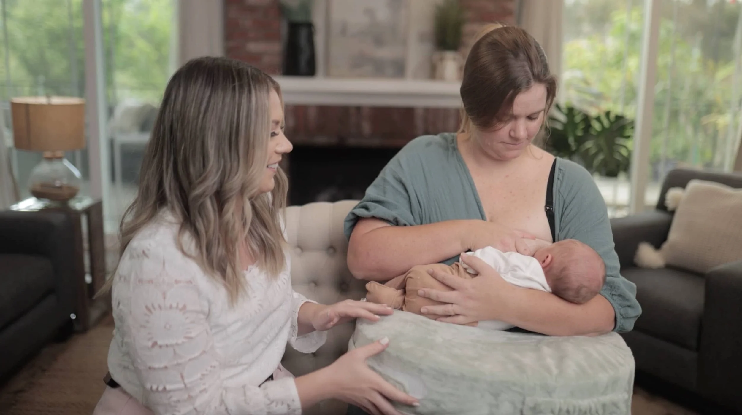 DONA certified doula Bree Zaccaro assists a mother with lactation support.