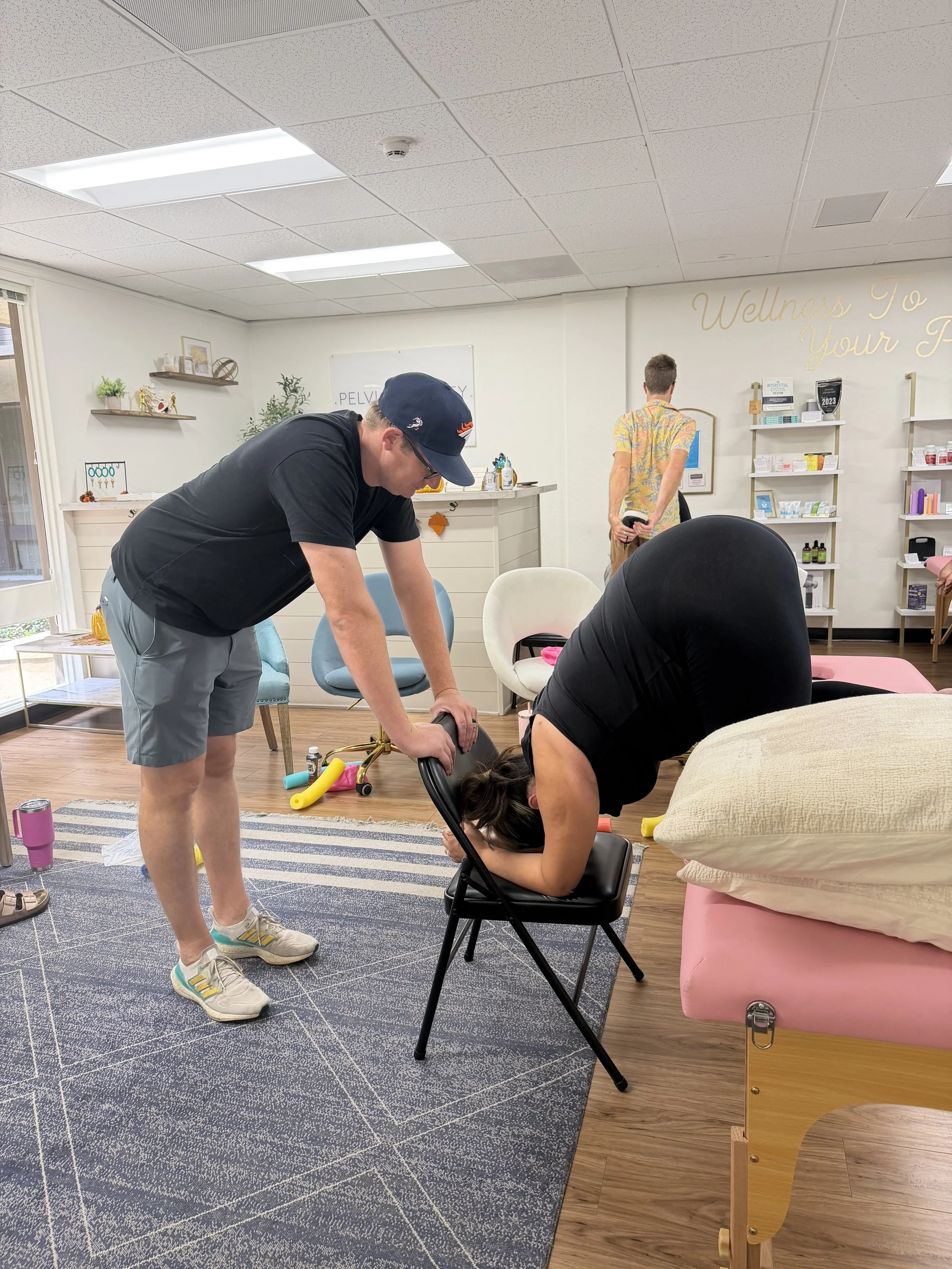A pregnant woman participating in a spinning babies technique in Orange County with The Breezy Doula team.