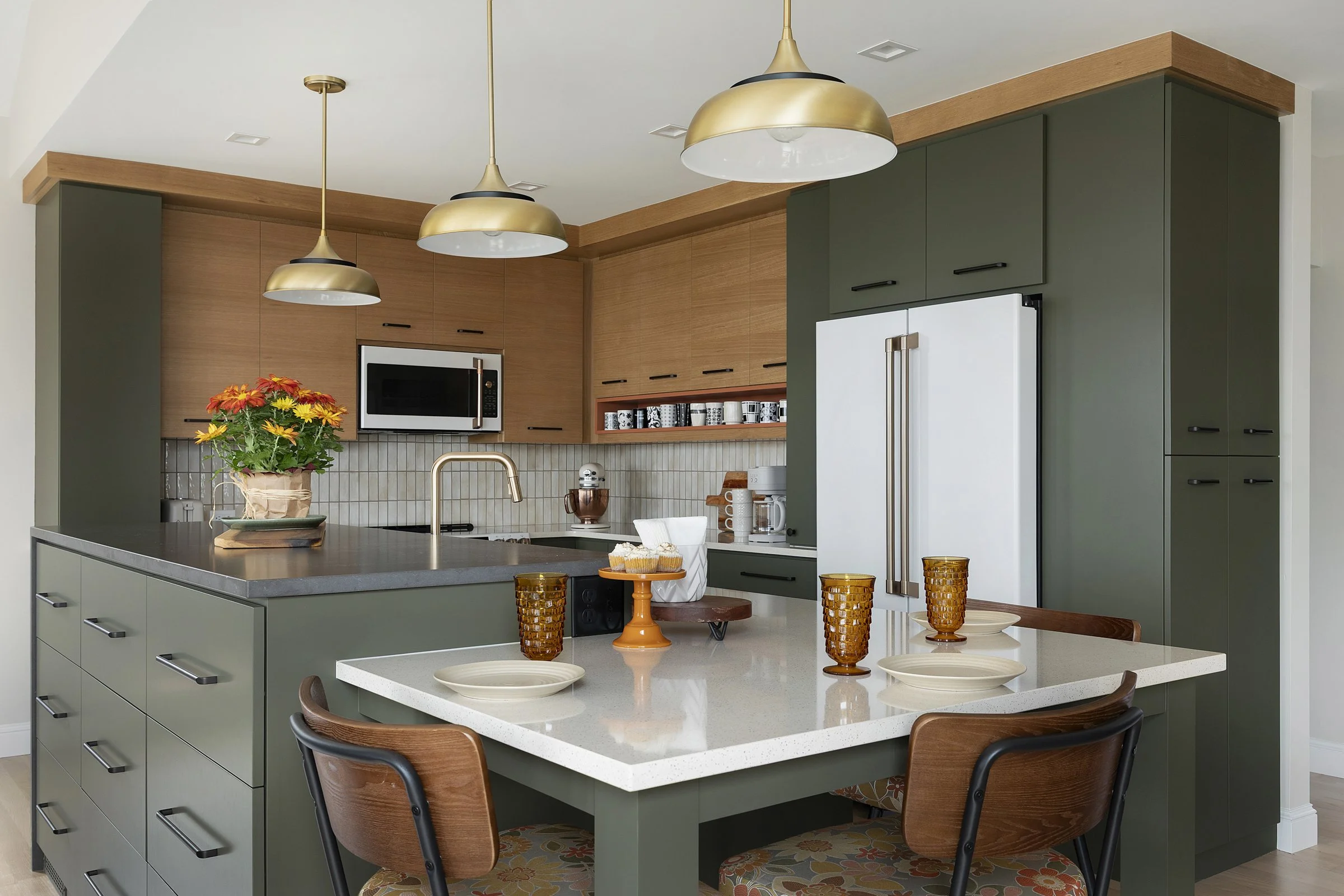 Sage green and wood cabinetry kitchen design Bloomington MN