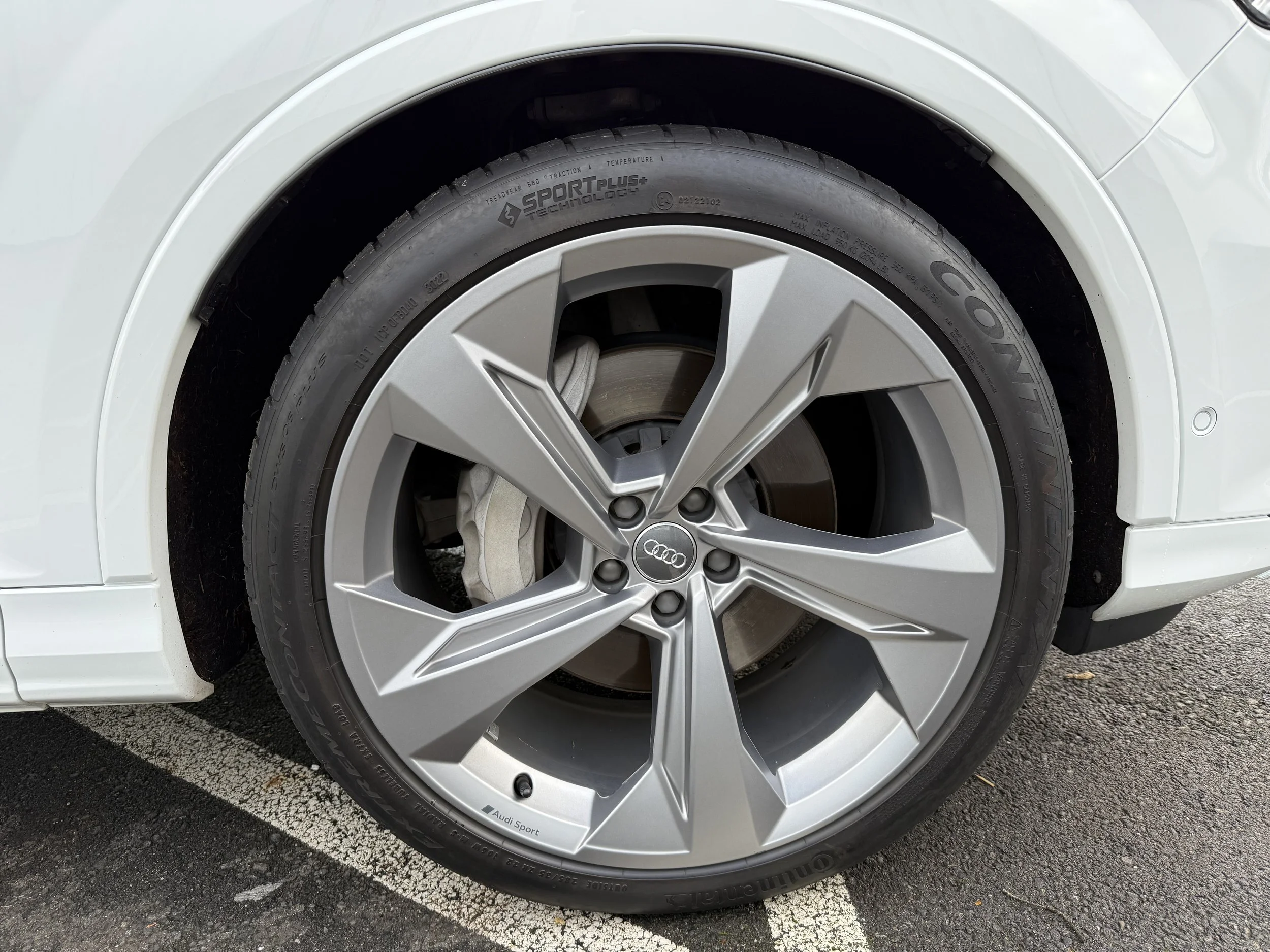 22" upgraded wheels with all-season Continental tires - 70% tread - passenger front