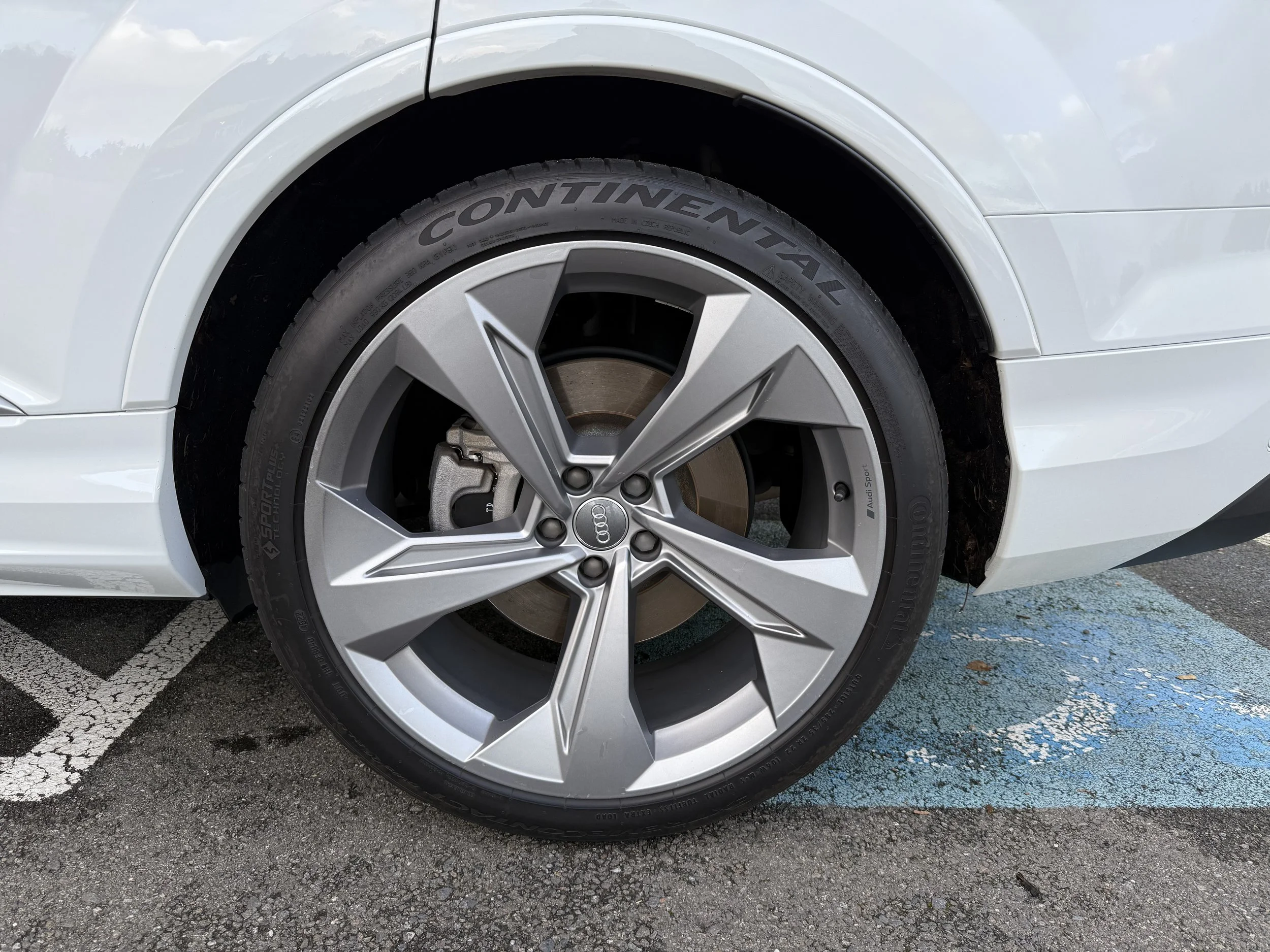 22" upgraded wheels with all-season Continental tires - 70% tread - driver rear