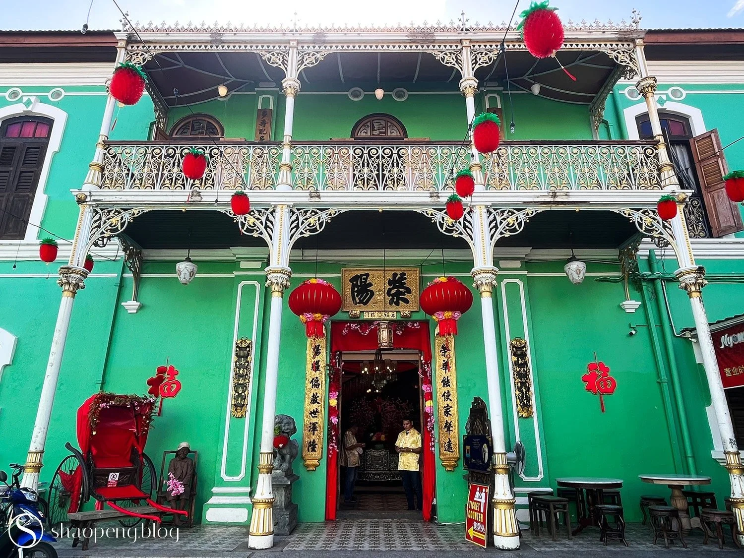 The Pinang Peranakan Mansion in George Town, Penang, stands out with its pandan-green architecture.
