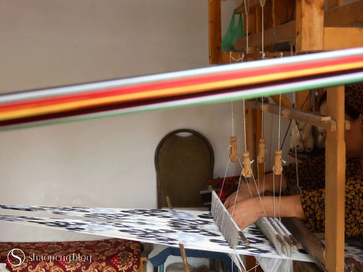 Artisan working at the loom at Margilan Crafts Development Centre