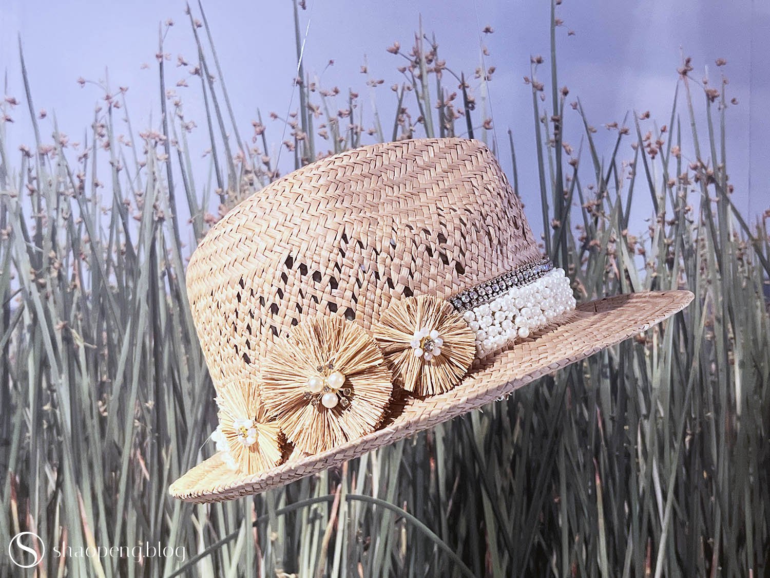 The craft of rush weaving is adapted into fashionable apparel, as seen in this hat.