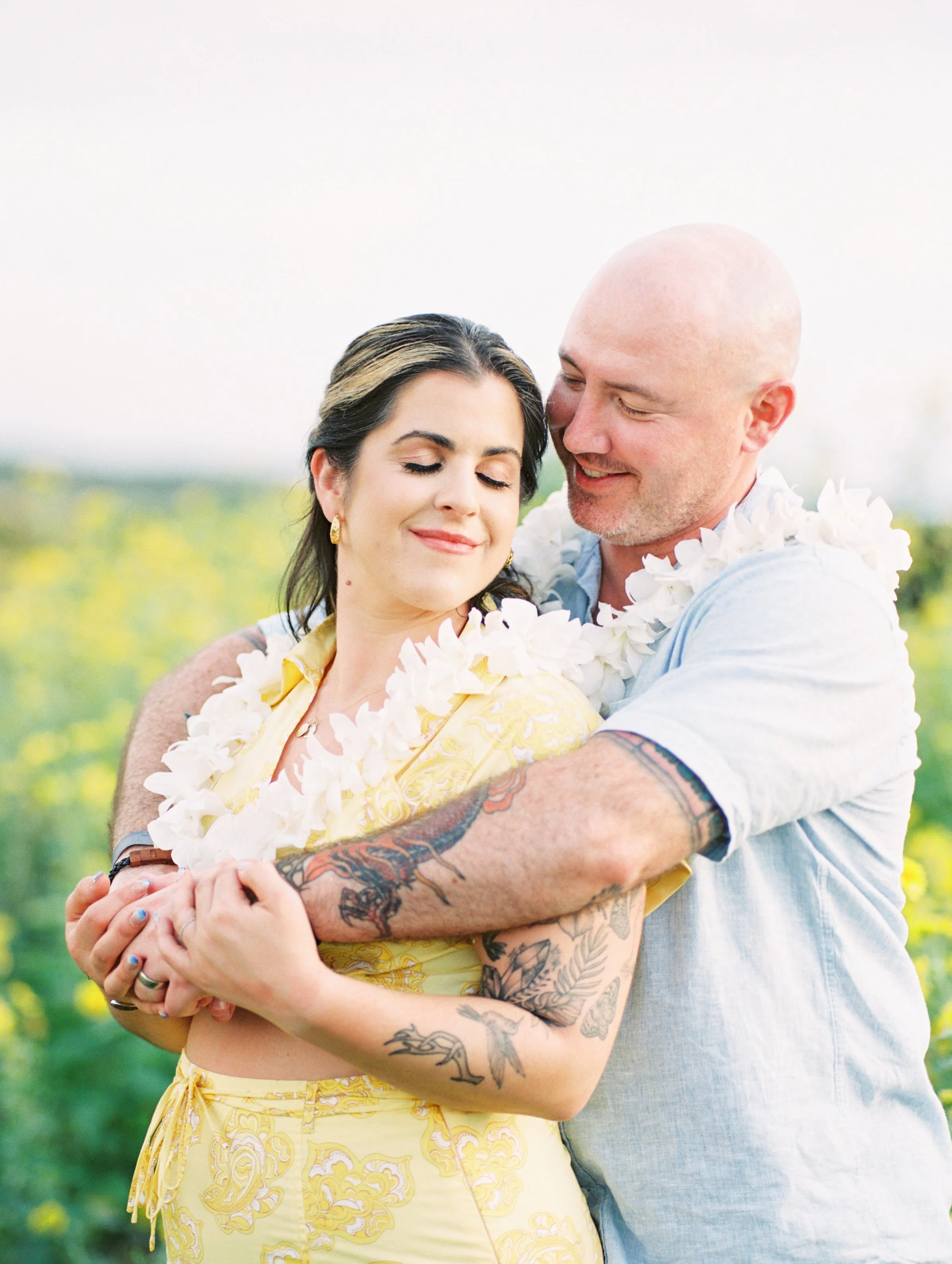 A wedding couple embracing at the Four Seasons Resort on Lanai