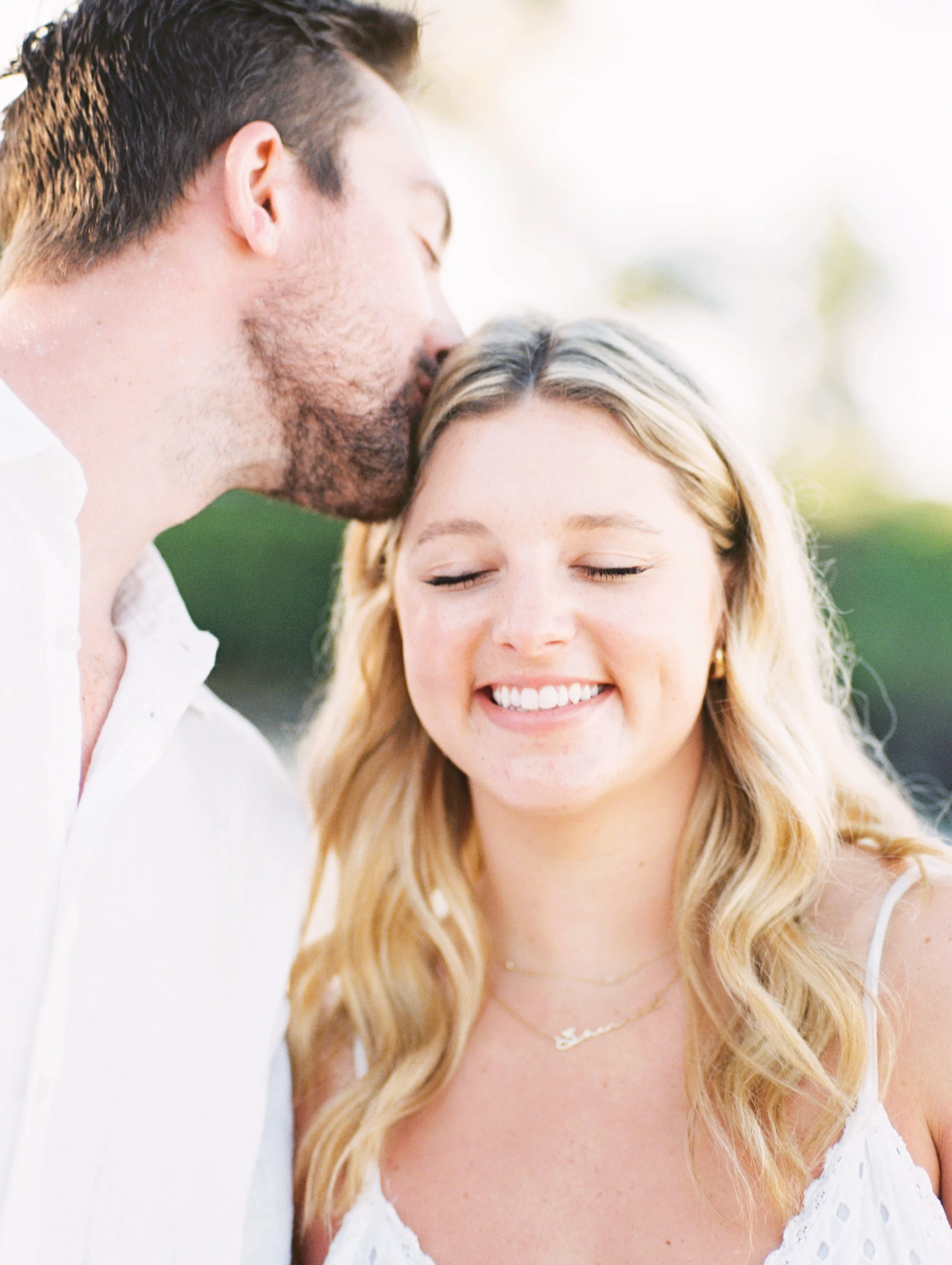 Romantic engagement photo on Maui with soft light and coastal scenery, captured on film by a Hawaii engagement photographer