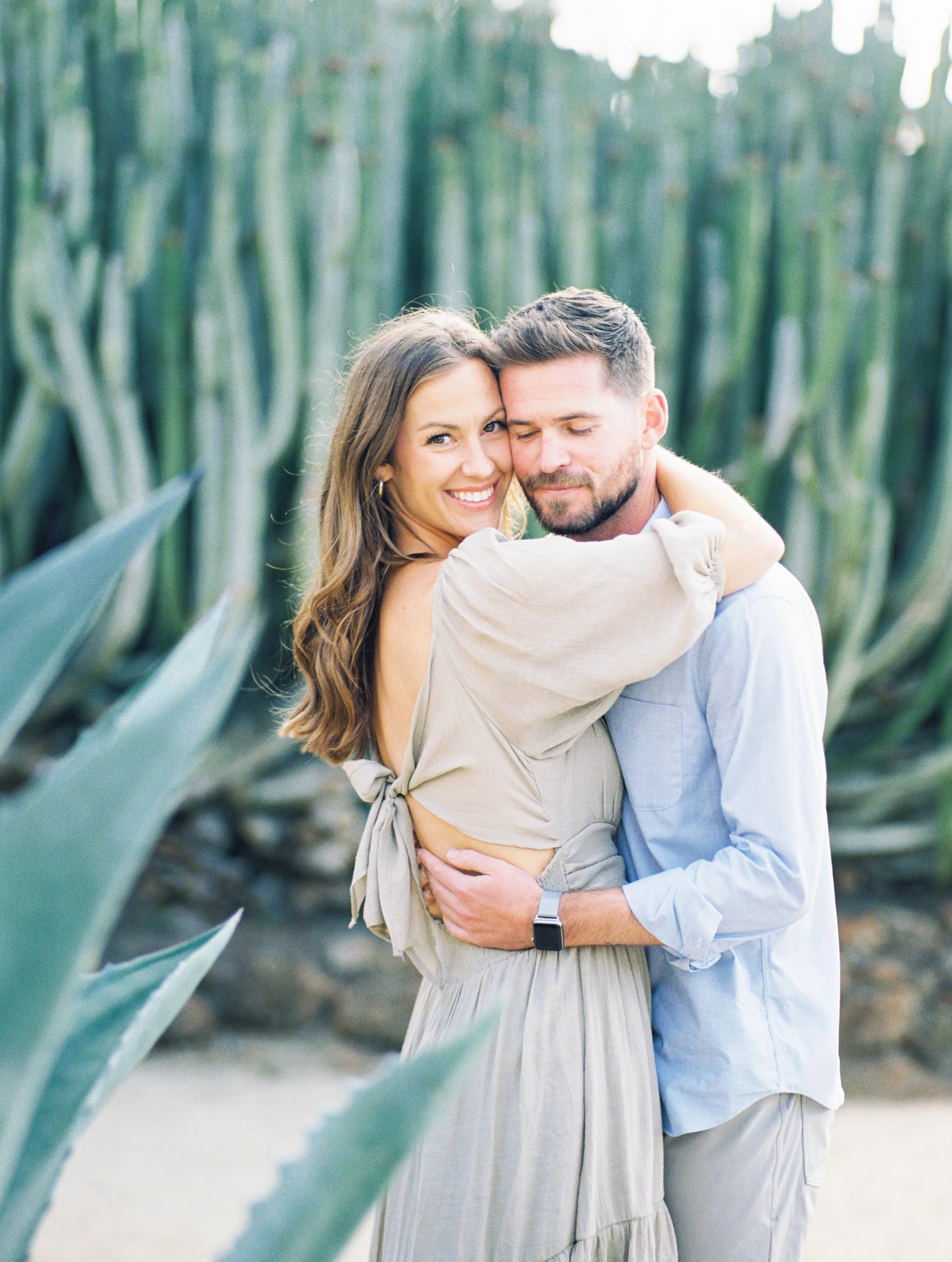 San Diego engagement photoshoot with warm light and candid moment photographed in a timeless style at Balboa Park