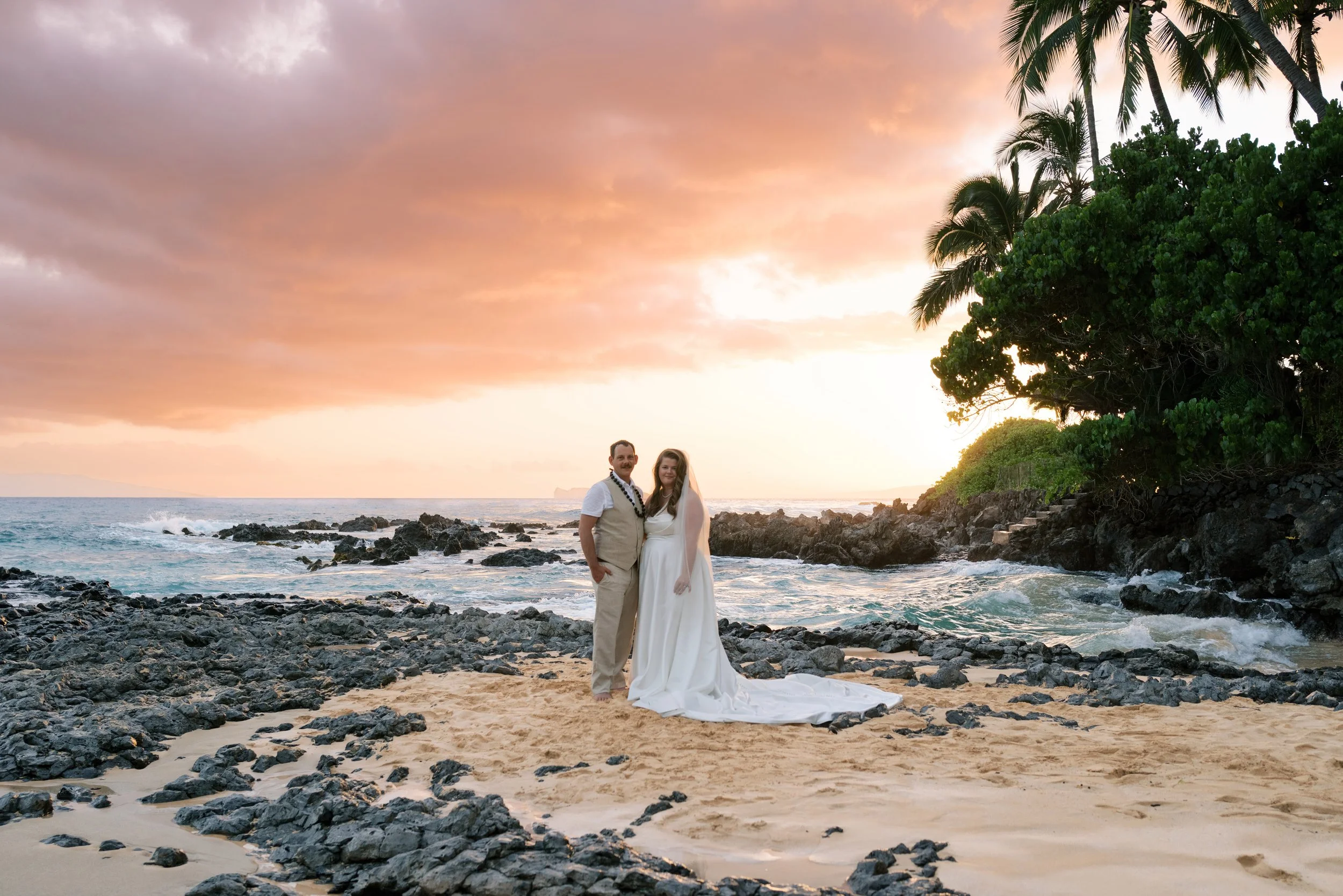 An intimate elopement at Makena Cove on Maui photographed at sunset.