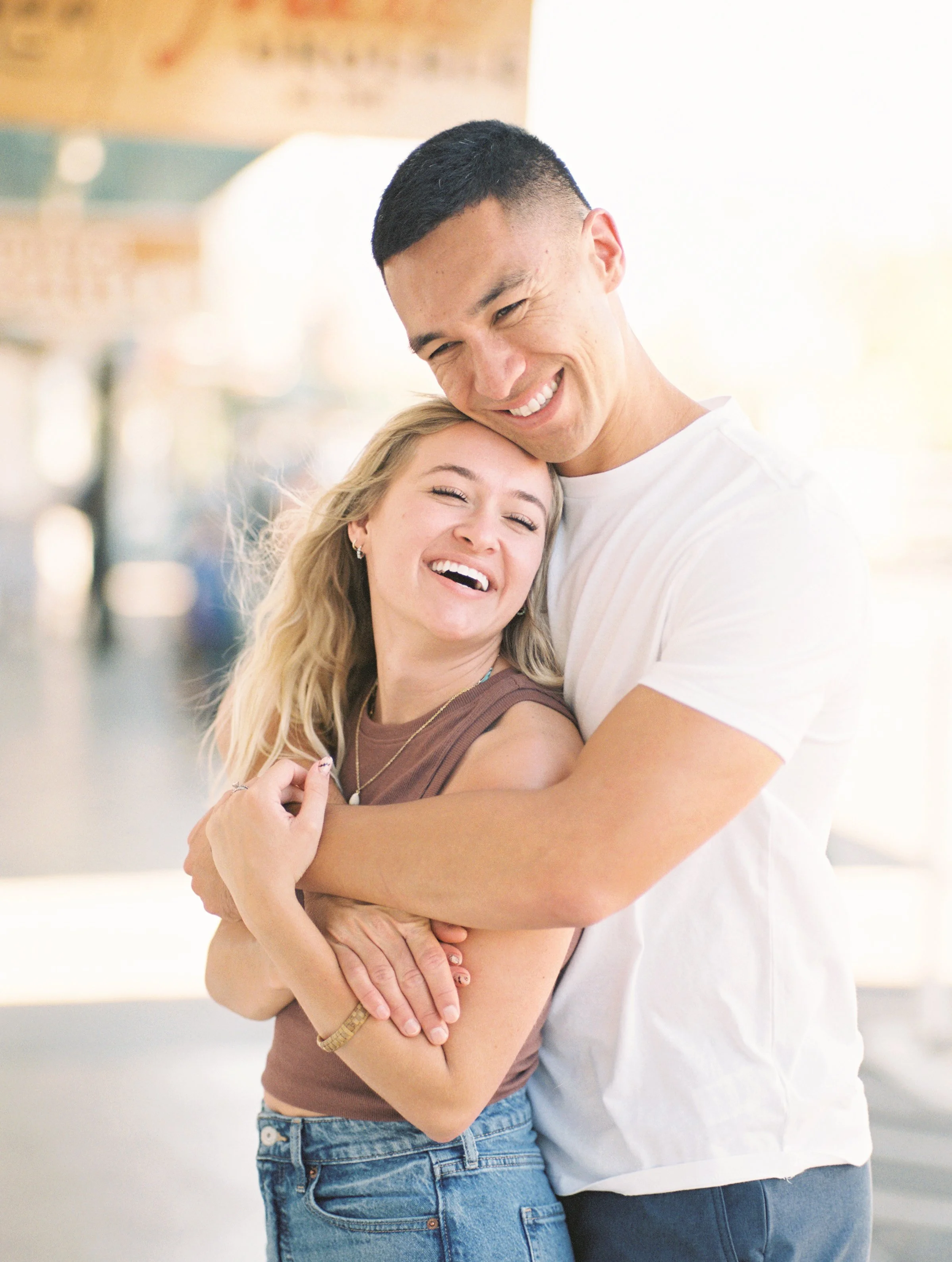 A couple laughing in Paia Maui captured on film