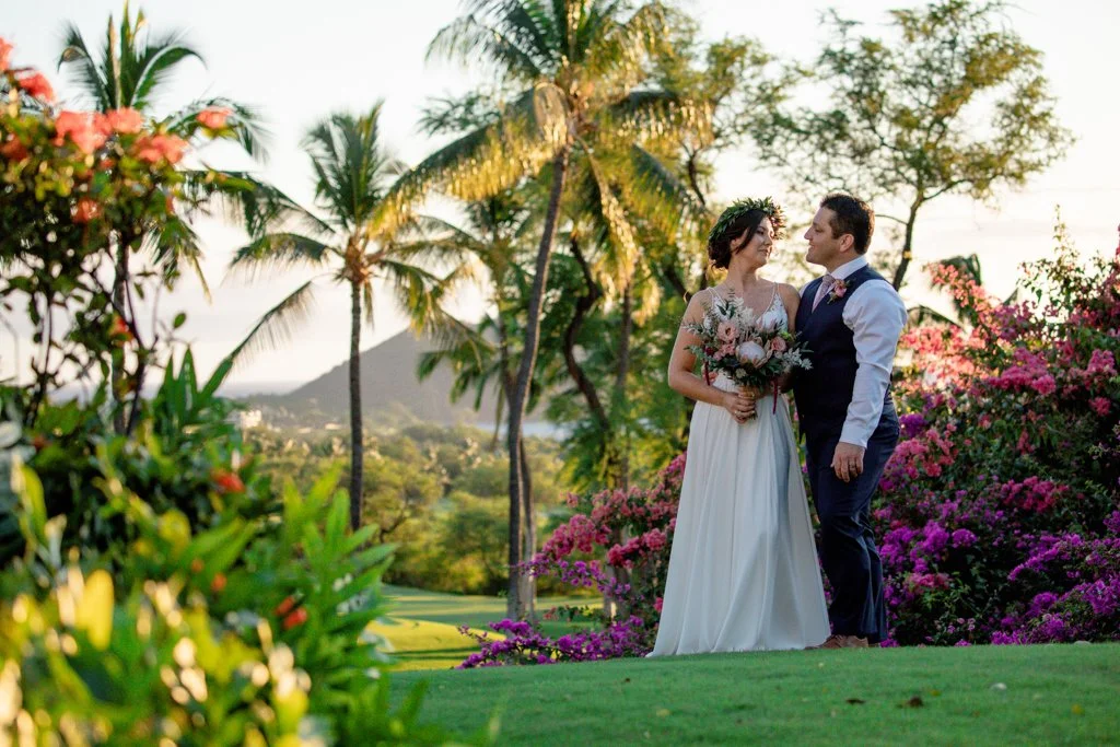 Bride and groom sharing a quiet moment on the golf course at Gather on Maui during sunset.