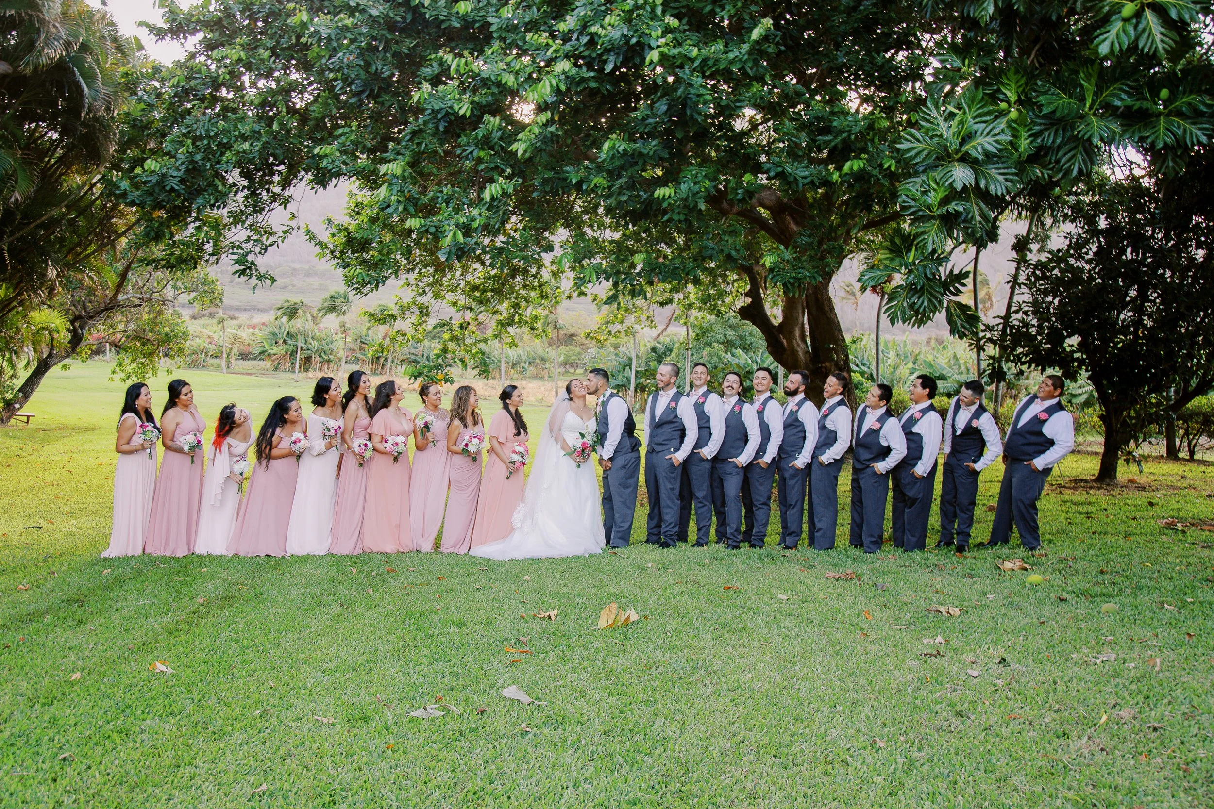 Wedding party at a tropical wedding ceremony photographed on film on Maui Hawaii