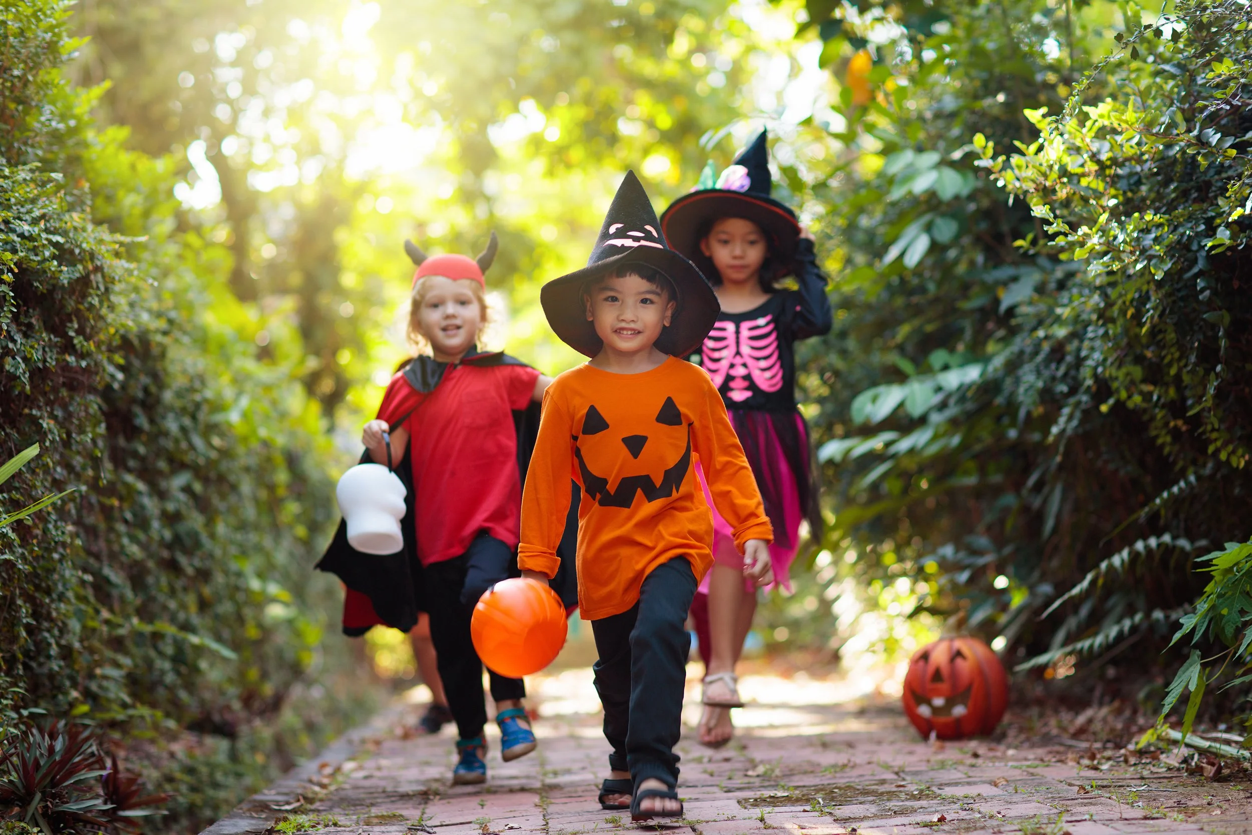 Kids wearing Halloween costumes