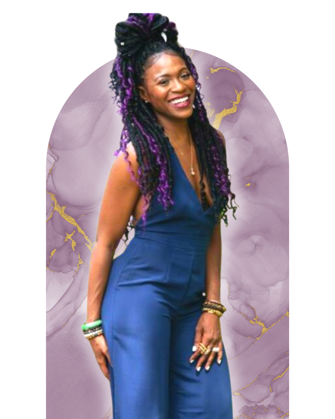 A woman with long purple and black dreadlocks, smiling and wearing a sleeveless navy jumpsuit, standing in front of a purple abstract background.