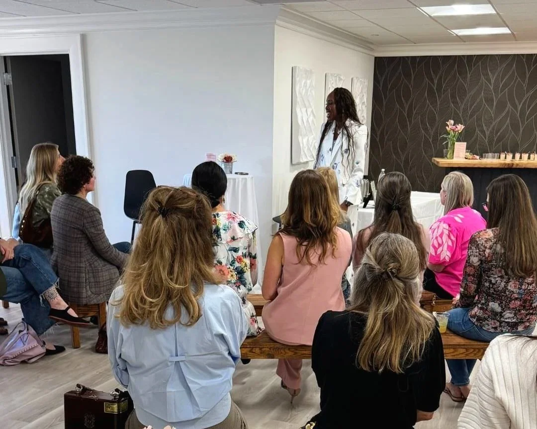 Guests seated at Morph Med Spa's Spring Soiree in Ridgefield, CT, listening to a speaker during the event.